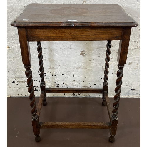 42 - An early 20th century oak serpentine top barley twist side table - approx. 77cm high x 39cm wide x 5... 