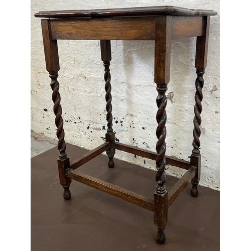 42 - An early 20th century oak serpentine top barley twist side table - approx. 77cm high x 39cm wide x 5... 