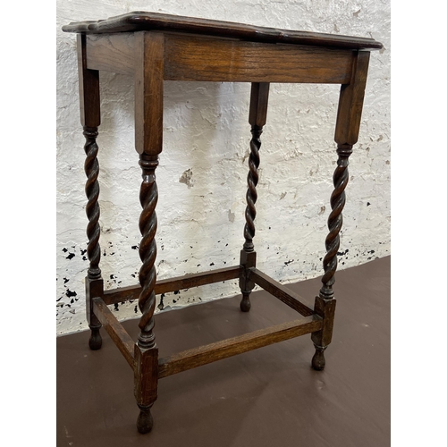 42 - An early 20th century oak serpentine top barley twist side table - approx. 77cm high x 39cm wide x 5... 