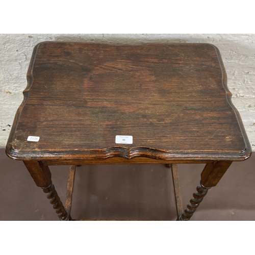 42 - An early 20th century oak serpentine top barley twist side table - approx. 77cm high x 39cm wide x 5... 