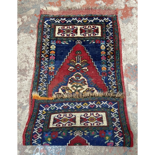 44 - A Turkish hand knotted rug - approx. 120cm x 55cm