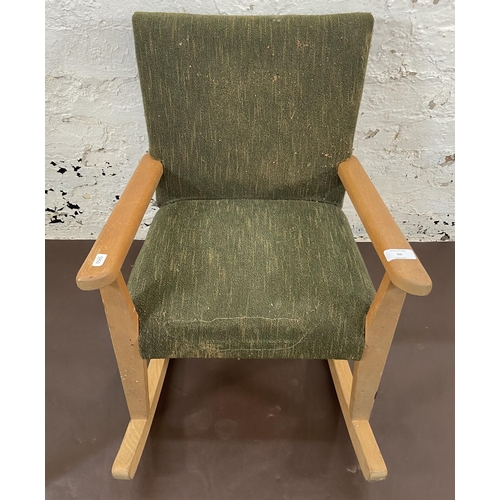 50 - A mid 20th century beech and green fabric upholstered child's rocking chair - approx. 60cm high x 44... 