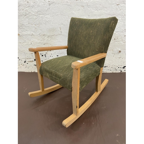 50 - A mid 20th century beech and green fabric upholstered child's rocking chair - approx. 60cm high x 44... 