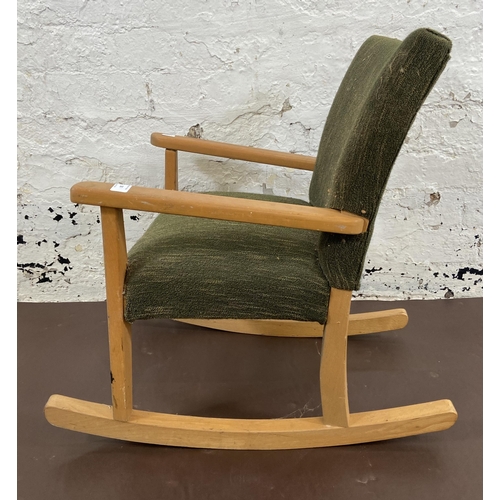 50 - A mid 20th century beech and green fabric upholstered child's rocking chair - approx. 60cm high x 44... 