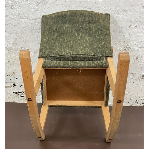 50 - A mid 20th century beech and green fabric upholstered child's rocking chair - approx. 60cm high x 44... 