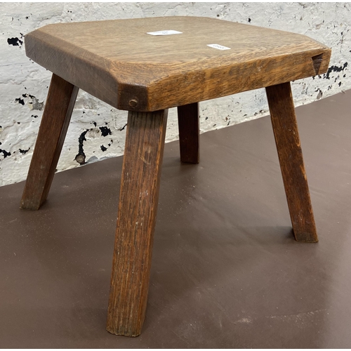 51 - An early 20th century oak farmhouse stool - approx. 25cm high x 26cm wide x 25cm deep