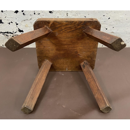 51 - An early 20th century oak farmhouse stool - approx. 25cm high x 26cm wide x 25cm deep