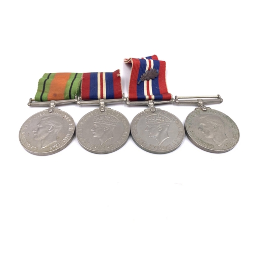 2201 - Five WWII British medals, three War and two The Defence