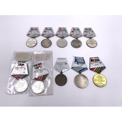 2204 - Ten USSR medals to include 20 Years Excellent Service, Order of Courage, Veteran of Labour etc.