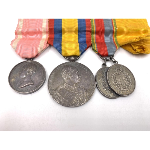 2207 - A set of four Thai medals to include King Rama V First Tour of Europe inscribed Monnaie De Paris Arg... 