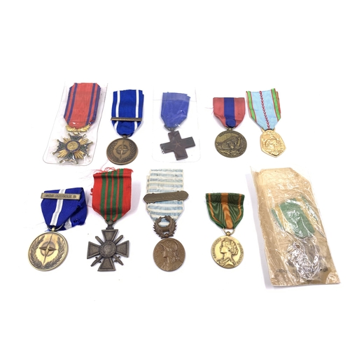 2208 - Ten medals to include French Commemorative War, French WWII Croix de Geurre, NATO Former Yugoslavia,... 