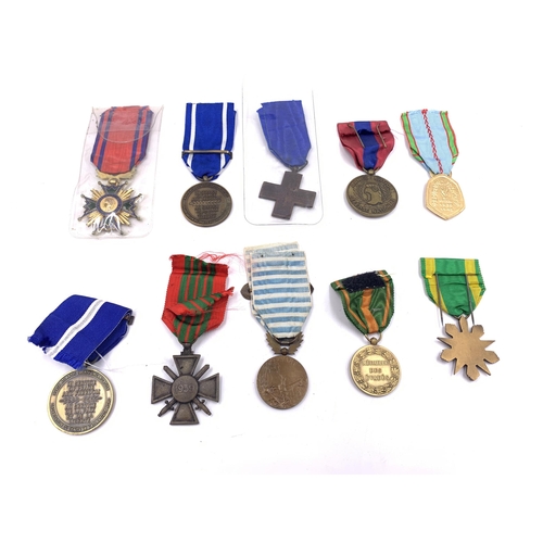 2208 - Ten medals to include French Commemorative War, French WWII Croix de Geurre, NATO Former Yugoslavia,... 