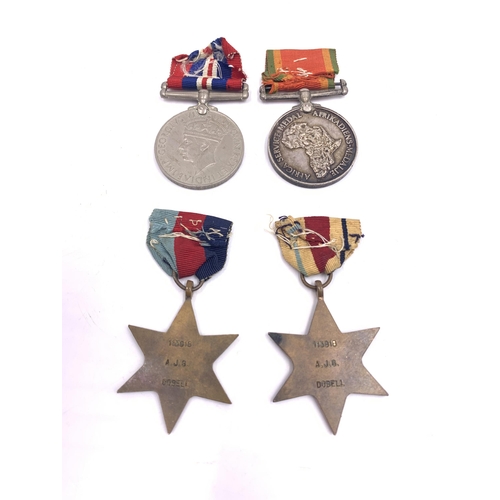 2220 - A WWII British four piece medal group presented to 113918 A.J.G. Dobell