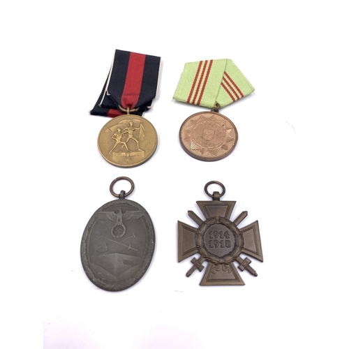 2227 - Four German medals, one III Reich West Wall, one 1938 Commemorative Sudetenland, one For Faithful Se... 