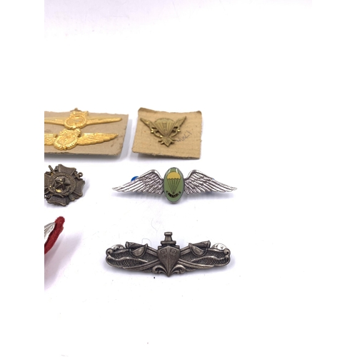 2230 - Ten military badges to include 44 Parachute Brigade, Spetsnaz, Border Regiment etc.