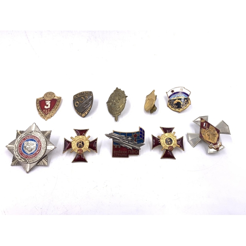 2232 - Ten military badges to include Russian 200 Years Ministry of Internal Affairs, Soviet Union Navy Sub... 