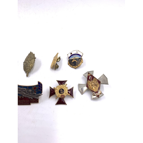 2232 - Ten military badges to include Russian 200 Years Ministry of Internal Affairs, Soviet Union Navy Sub... 