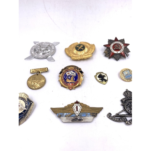 2238 - Ten military badges to include Soviet Union Order of The Patriotic War, Lowland Brigade Officers cap... 