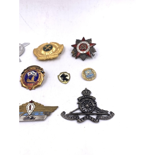 2238 - Ten military badges to include Soviet Union Order of The Patriotic War, Lowland Brigade Officers cap... 