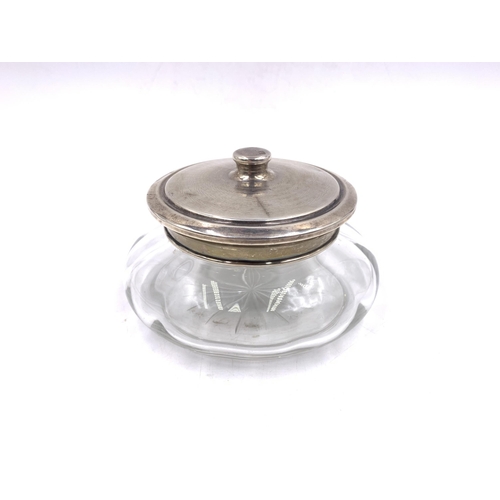 2098 - A glass powder jar with hallmarked Birmingham silver lid, dated 1925 - approx. 13cm diameter