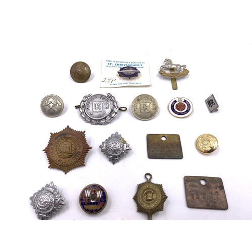 2244 - A collection of badges and plaques to include two Rolls Royce Crewe Division brass plaques, two Roll... 