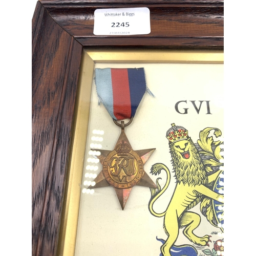 2245 - An oak framed WWII four piece medal group with scroll presented to Corporal H. Bould Royal Army Ordn... 