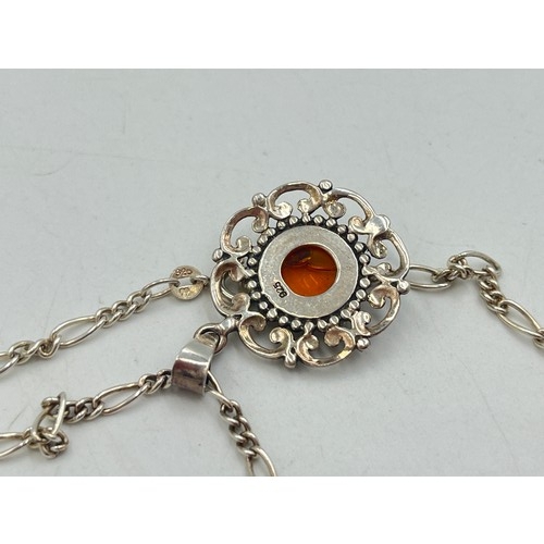 2095A - Three pieces of .925 silver jewellery, one amber pendant necklace, one amber brooch and one filigree... 