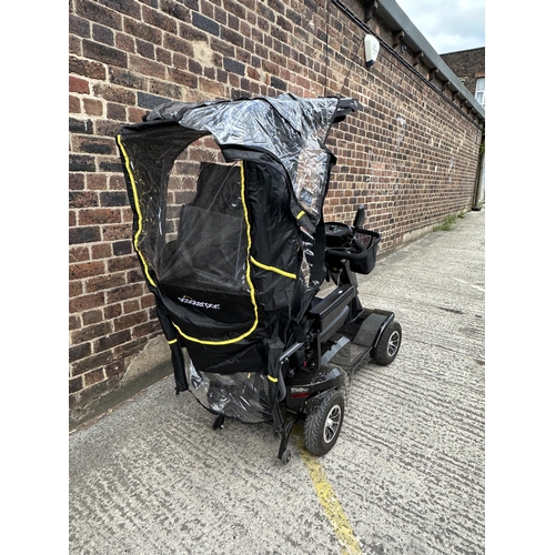 1021 - A Sterling S700 road legal 8mph long range mobility scooter with foldable weather cover