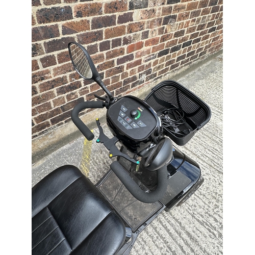 1021 - A Sterling S700 road legal 8mph long range mobility scooter with foldable weather cover