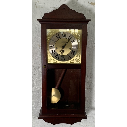 45 - An Acctim mahogany cased Westminster chime wall clock - approx. 70cm high x 30cm wide