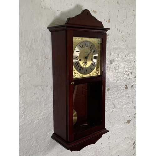 45 - An Acctim mahogany cased Westminster chime wall clock - approx. 70cm high x 30cm wide