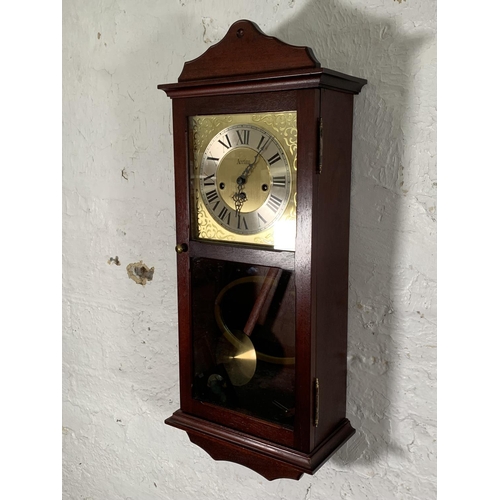 45 - An Acctim mahogany cased Westminster chime wall clock - approx. 70cm high x 30cm wide