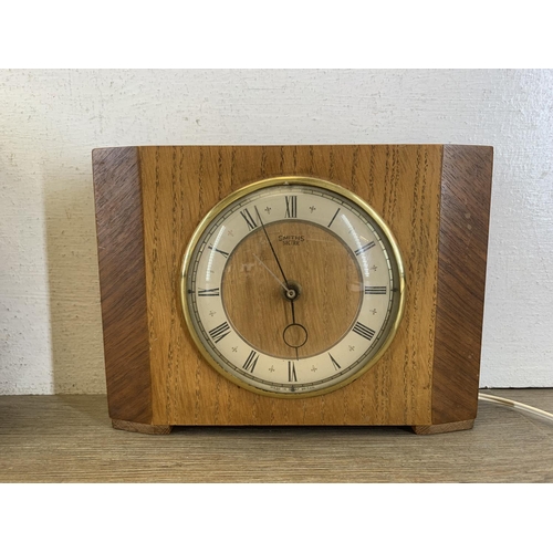 85 - Three mid 20th century clocks, one Smiths Sectric oak cased mantel, one Smiths battery wall and one ... 