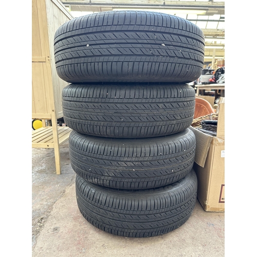 1051 - Four steel wheels with Bridgestone Ecopia EP150 195/65R15 91H tubeless tyres and Toyota wheel trims