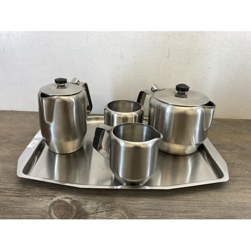 442 - Seven pieces of mid 20th century stainless steel kitchenware, five piece tea and coffee set, one Boc... 