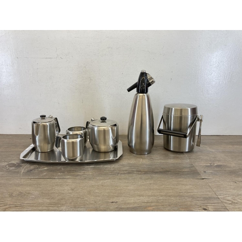 442 - Seven pieces of mid 20th century stainless steel kitchenware, five piece tea and coffee set, one Boc... 