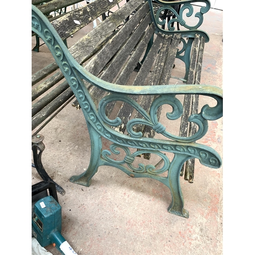 1084 - Two cast iron and wooden slatted garden benches - both approx. 127cm wide x 80cm high