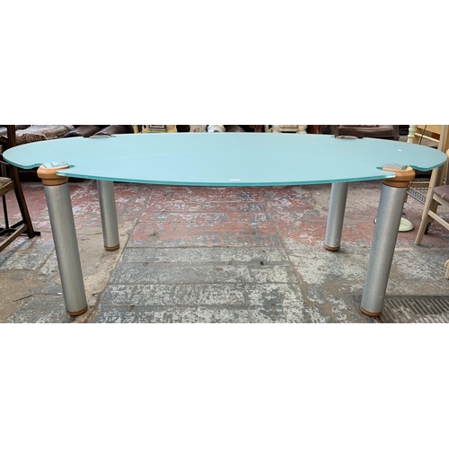 164 - A modern glass top dining table on hardwood and brushed steel supports - approx. 75cm high x 110cm w... 