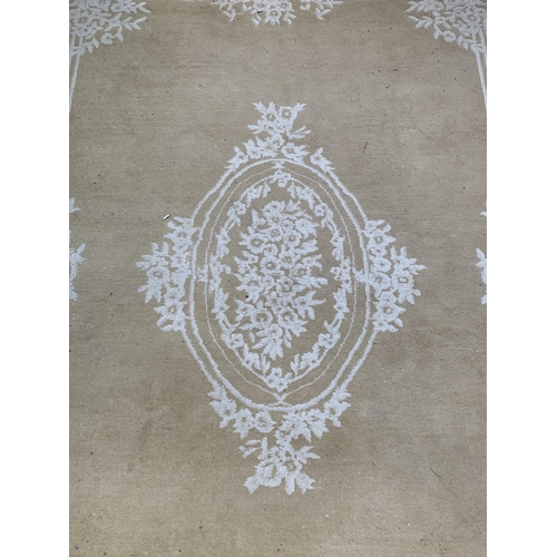 176 - An Indian pure new wool pile floral pattern rug - approx. 380cm x 280cm