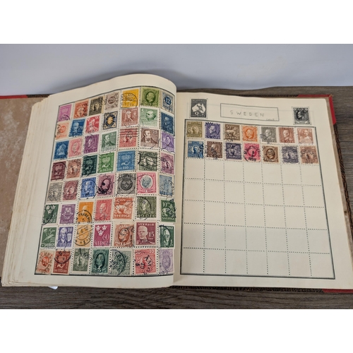 509 - A mid 20th century stamp album containing a collection of Worldwide stamps