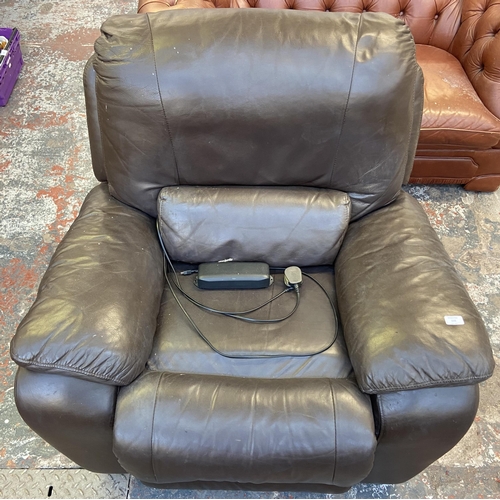 254 - A brown leather electric reclining armchair