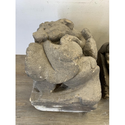 517 - Two medieval carved stone gargoyle corbels - largest approx. 40cm high x 25cm wide