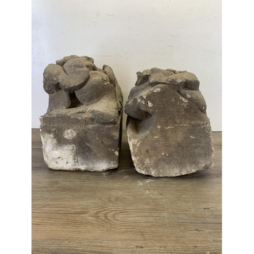 517 - Two medieval carved stone gargoyle corbels - largest approx. 40cm high x 25cm wide