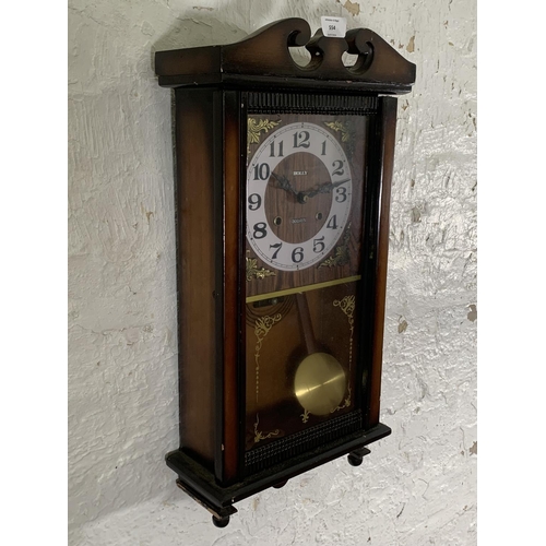 262 - A late 20th century Holly 30 day chiming wall clock