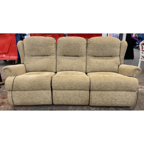 265 - A modern fabric upholstered electric reclining three seater sofa