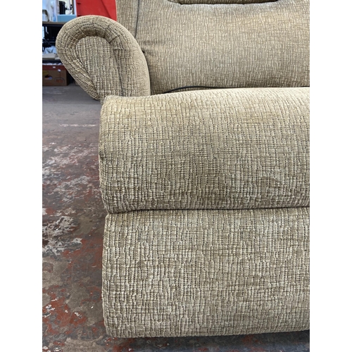 265 - A modern fabric upholstered electric reclining three seater sofa