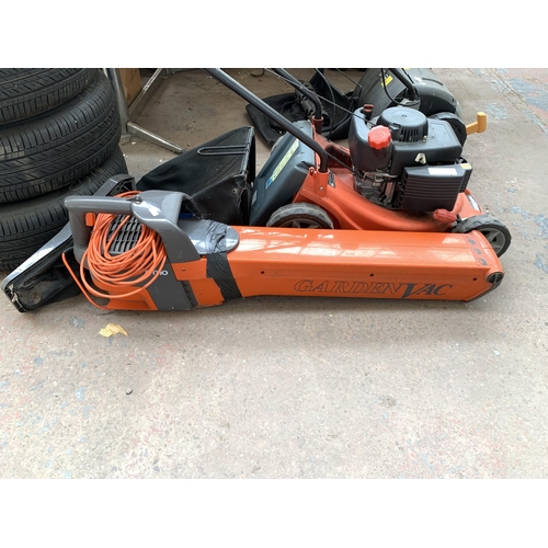 1050 - Two items, one Sovereign petrol lawn mower and one Flymo garden vac