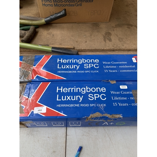 1053 - Two boxes of Herringbone luxury flooring - covers approx. 2²m