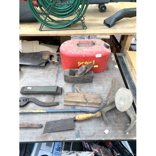 1058 - A collection of vintage hand tools to include G clamps, plane, hatchet, H. Disston & Sons hand saws ... 