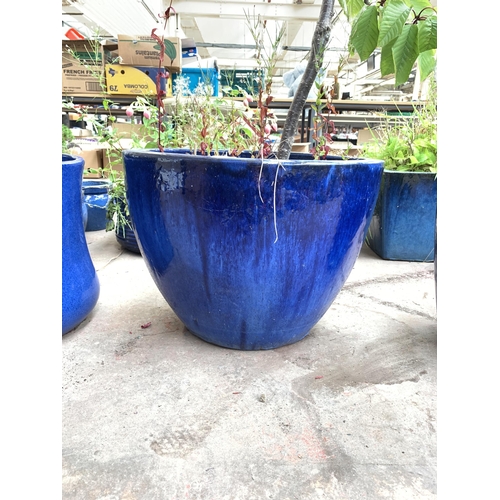 1070 - A blue glazed oval garden planter - approx. 38cm high x 50cm wide